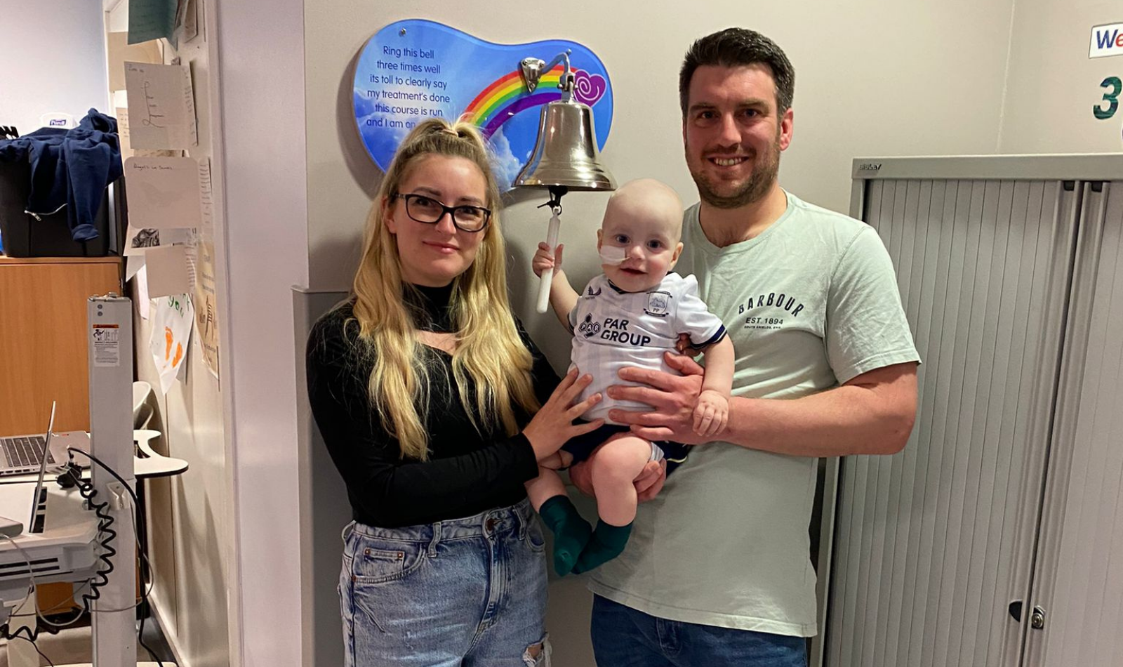 Louie in hospital with his parents